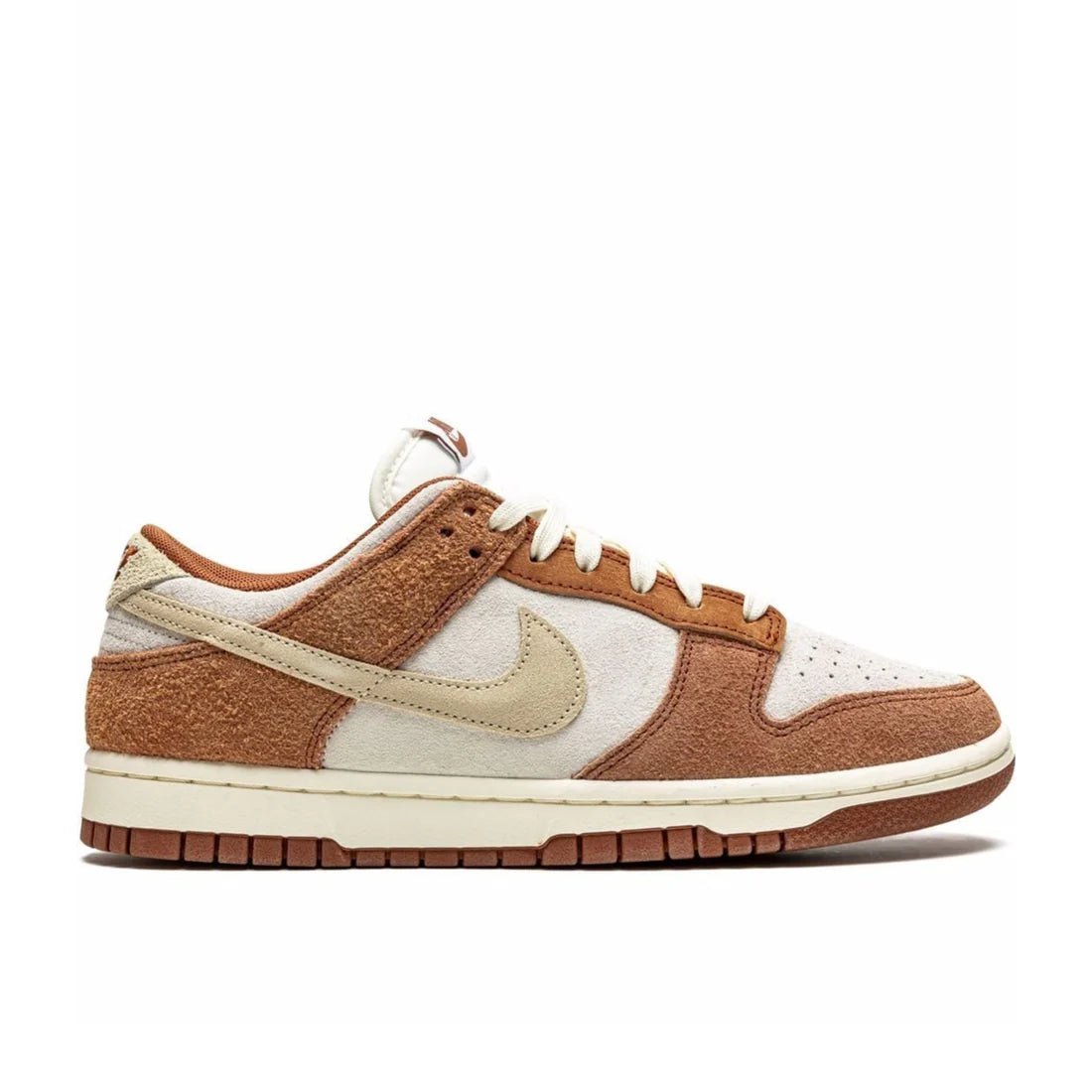 Nike Dunk Low PRM "Medium Curry" sneaker side view showing sail leather base, brown suede overlays, and white midsole | Premium Nike Dunks
