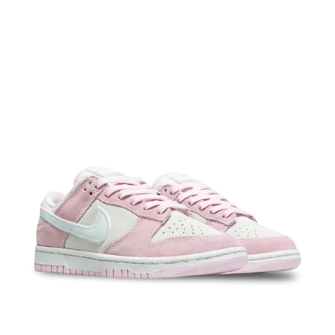 Front view of Nike Women's Dunk Low LX "Pink Foam" in white and light pink, showcasing perforated toe box and pink laces