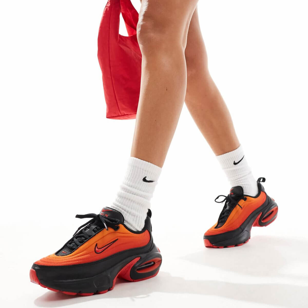 Woman wearing colorful Nike Air Max Portal sneakers