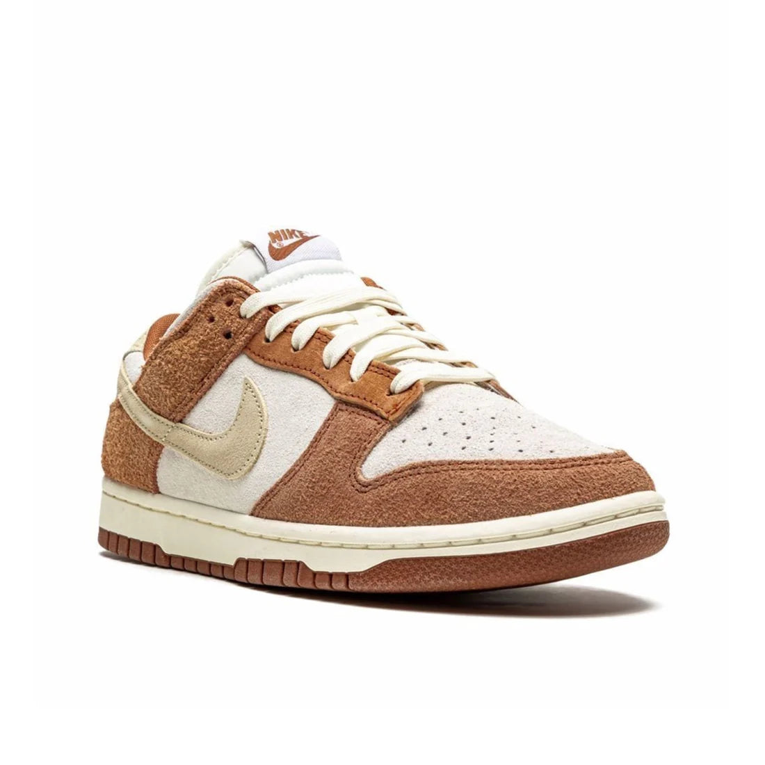 Front view of Nike Dunk Low PRM "Medium Curry" in sail and brown, showcasing perforated toe box and cream laces