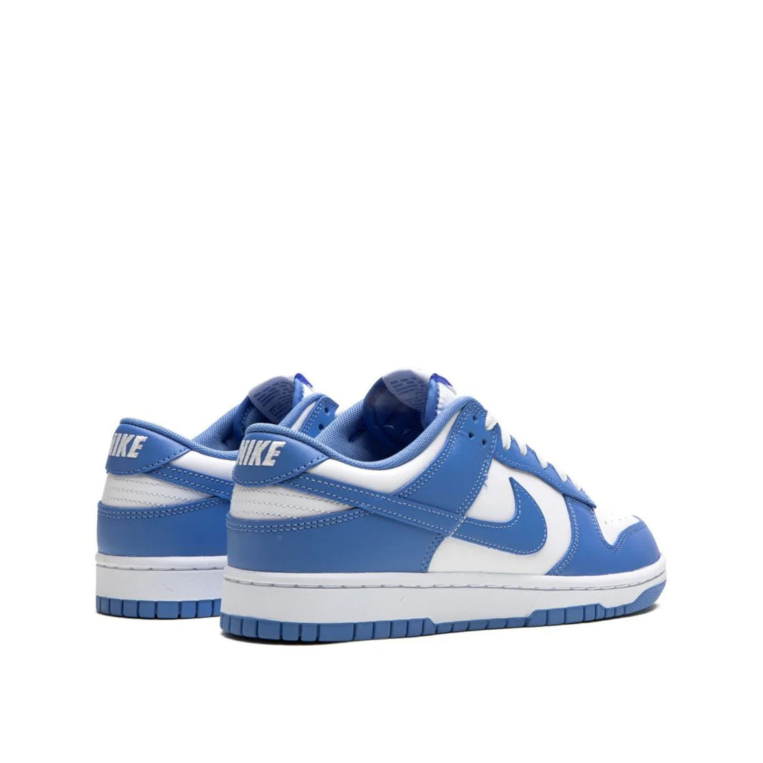 op-down view of Nike Dunk Low "Polar Blue" shoe highlighting white and light blue leather upper and white laces