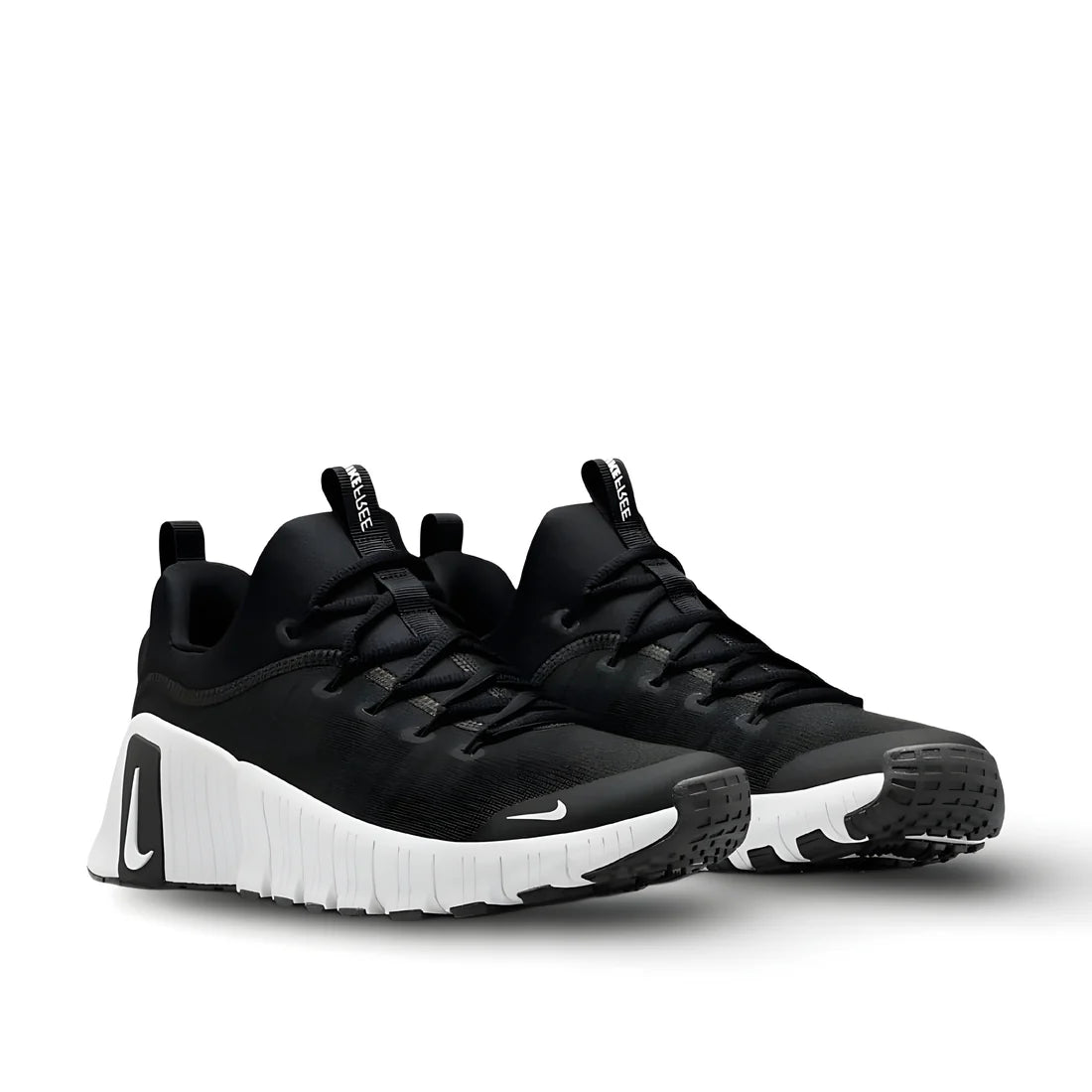 Front view of Nike Free Metcon 6 "Black and White" training shoe showcasing classic two-tone design, lacing system, and flexible forefoot