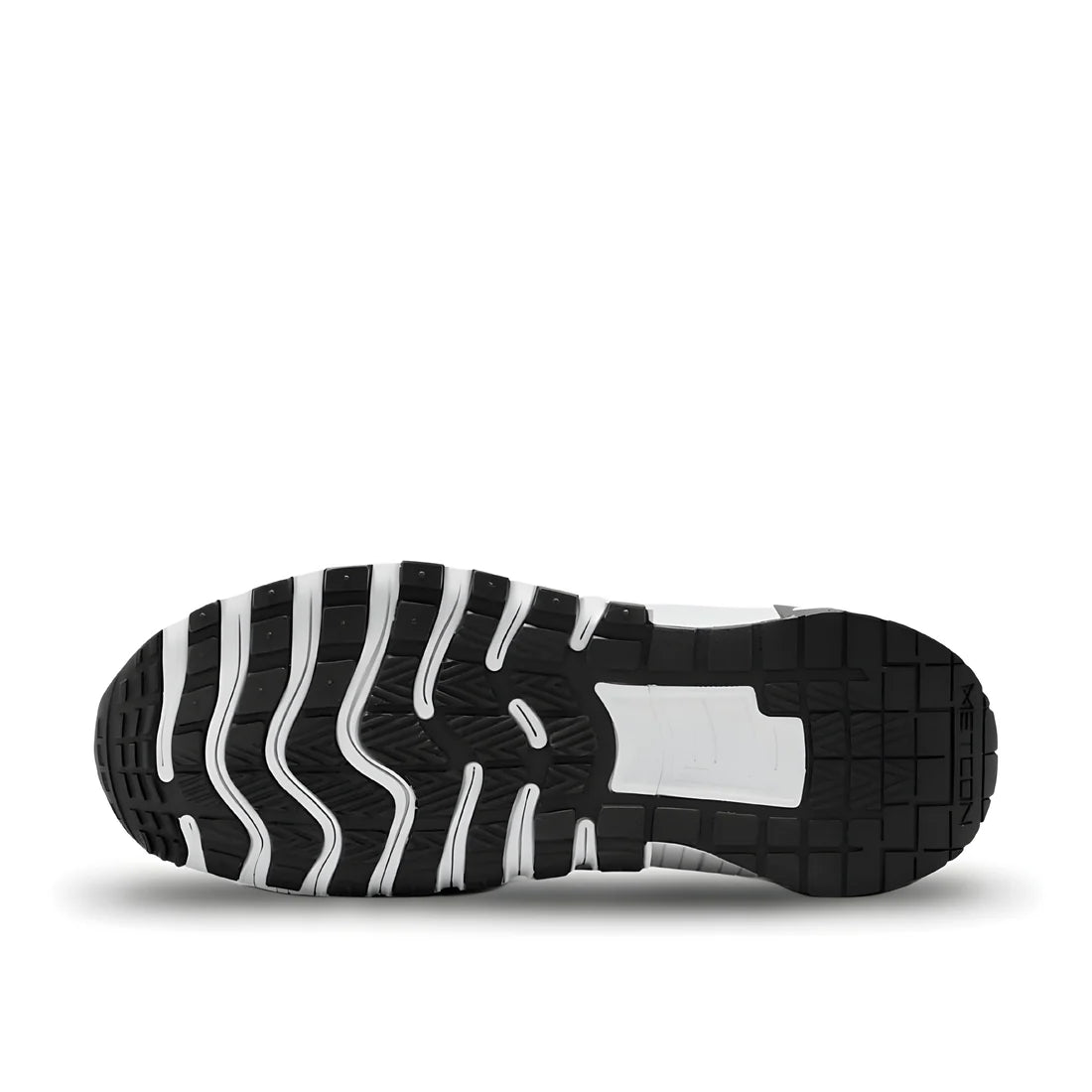 Nike Free Metcon 6 "Black and White" sole view showing multi-directional black rubber outsole pattern with white accents for grip and flexible forefoot grooves