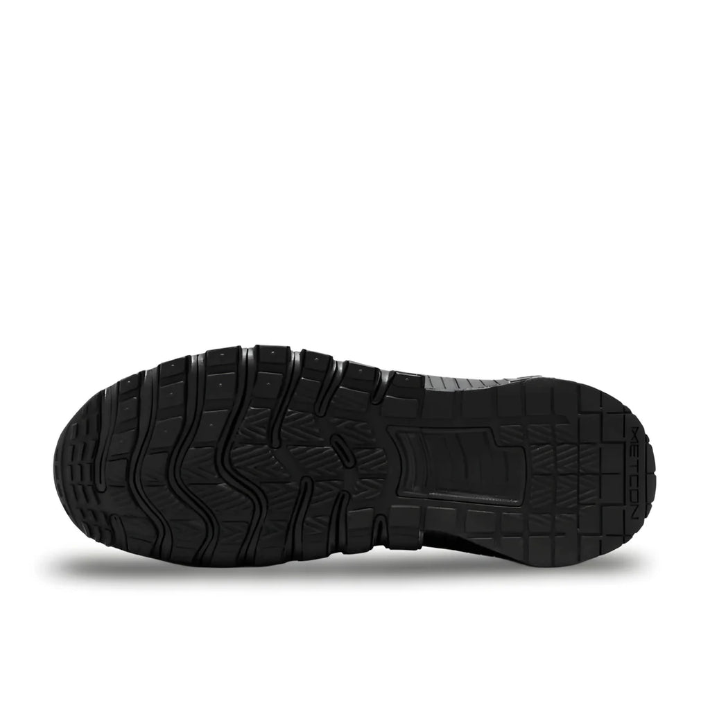 Nike Free Metcon 6 "Full Black" sole view showing multi-directional black rubber outsole pattern for grip and flexible forefoot grooves.