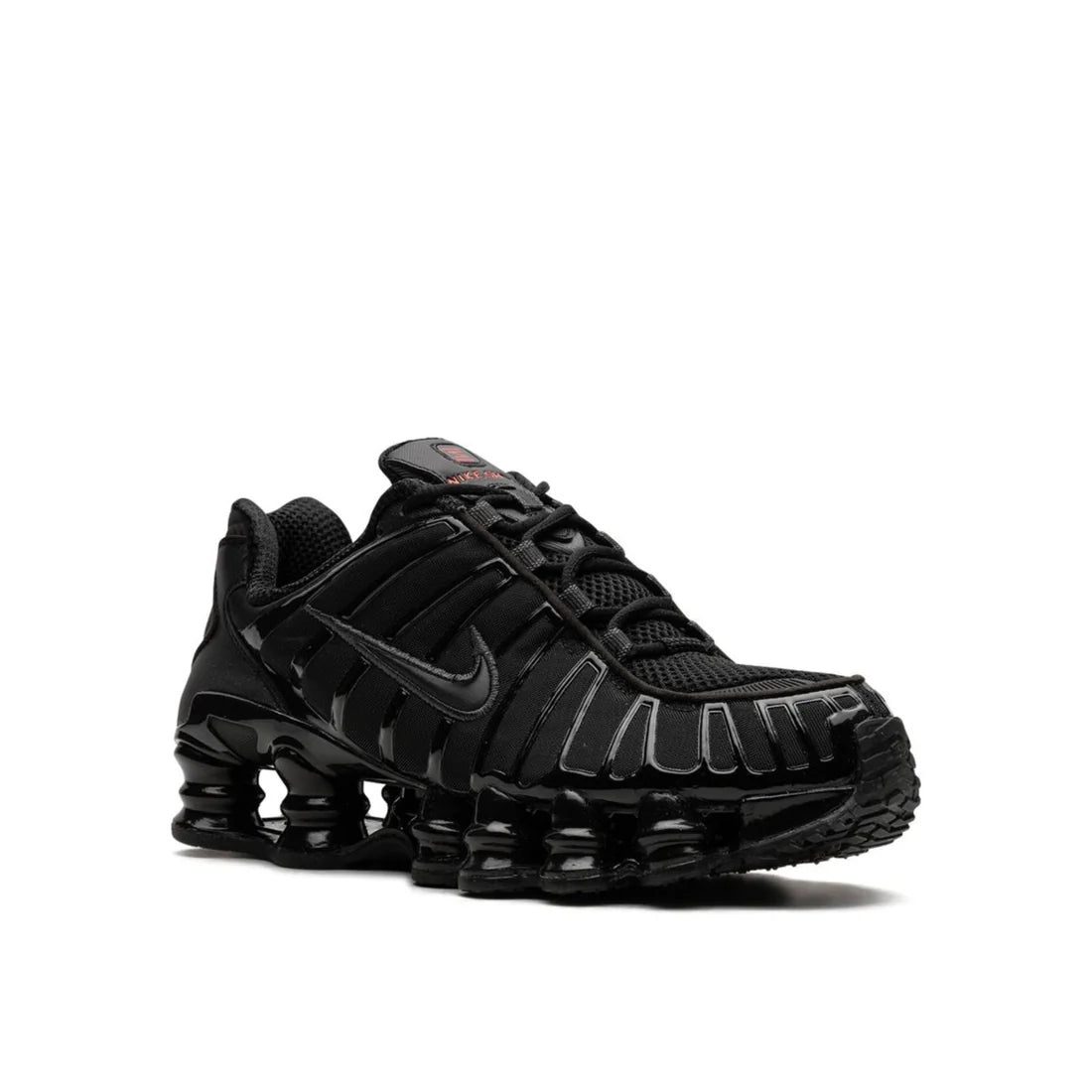 Front view of Nike Shox "Black Max Orange" shoe, highlighting black toe box, orange lacing details, and signature Shox design