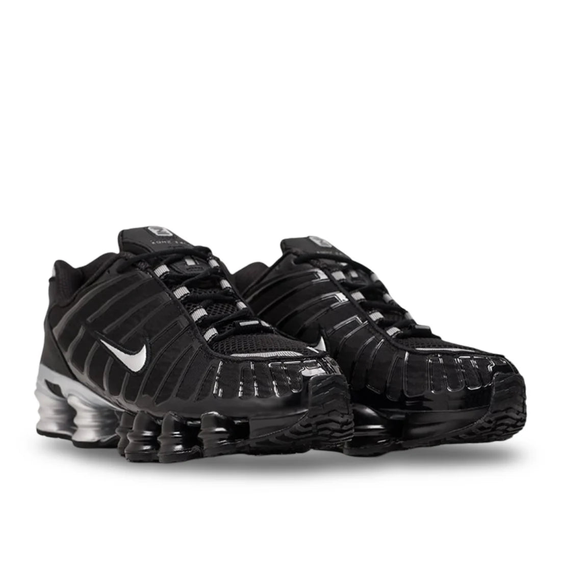 Front view of Nike Shox TL "Black/Metallic Silver" shoe, highlighting black toe box, metallic silver lacing system, unique caged upper, and prominent silver sole