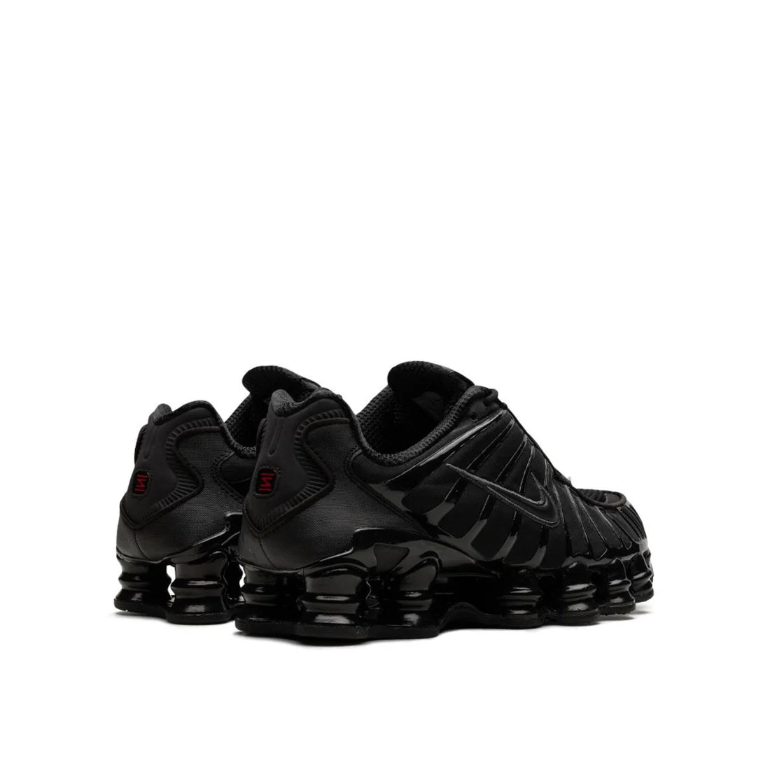Back view of Nike Shox "Black Max Orange" sneaker, showing black and orange upper materials
