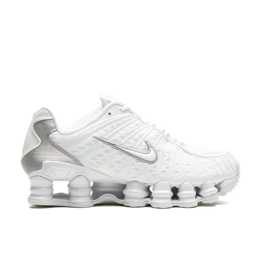Nike Shox TL "Silver White" sneaker side profile showing metallic silver mesh upper, white details, and full-length Shox columns visible in the sole