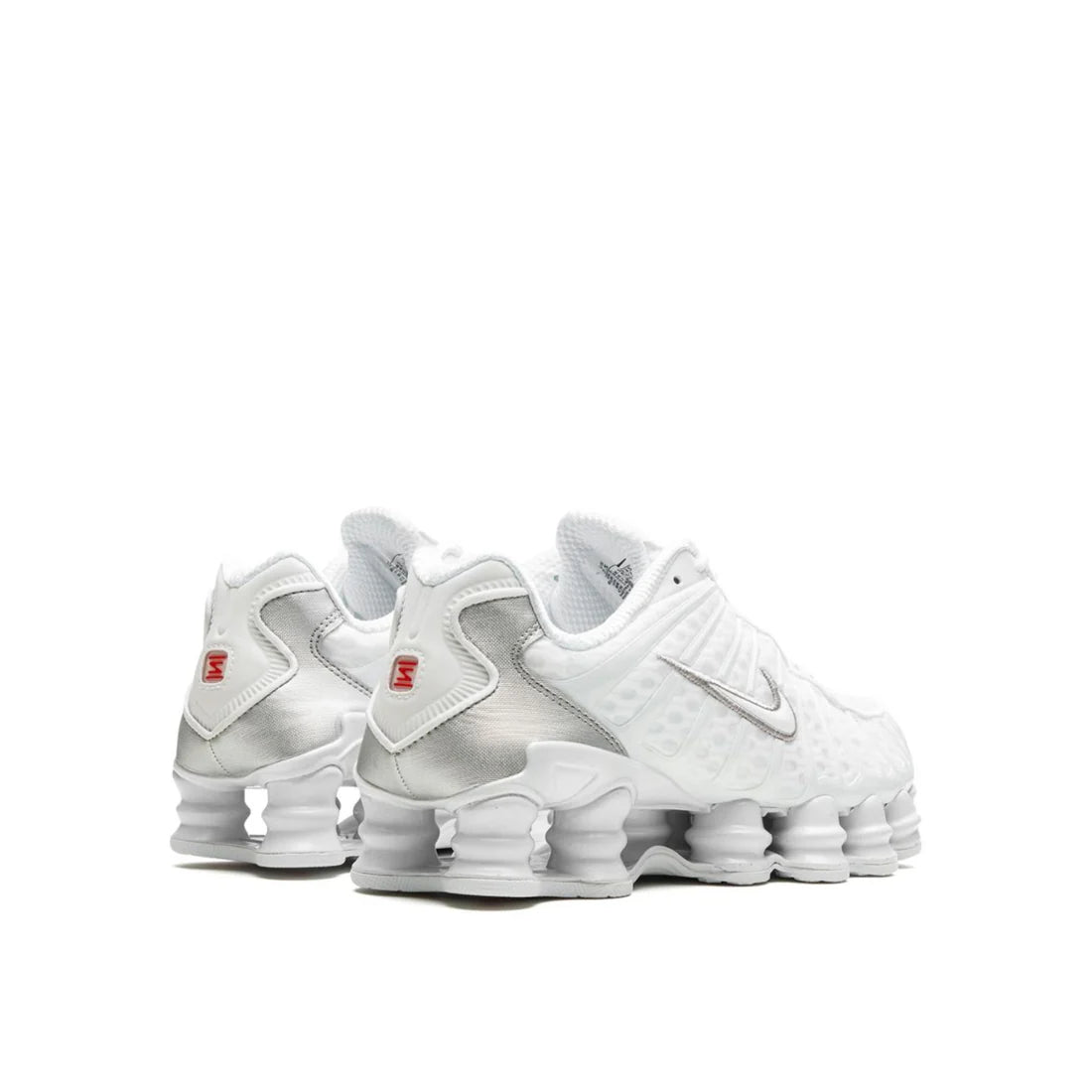 Back view of Nike Shox TL "Silver White" sneaker, showing metallic mesh upper, white overlays, and full-length Shox sole beneath