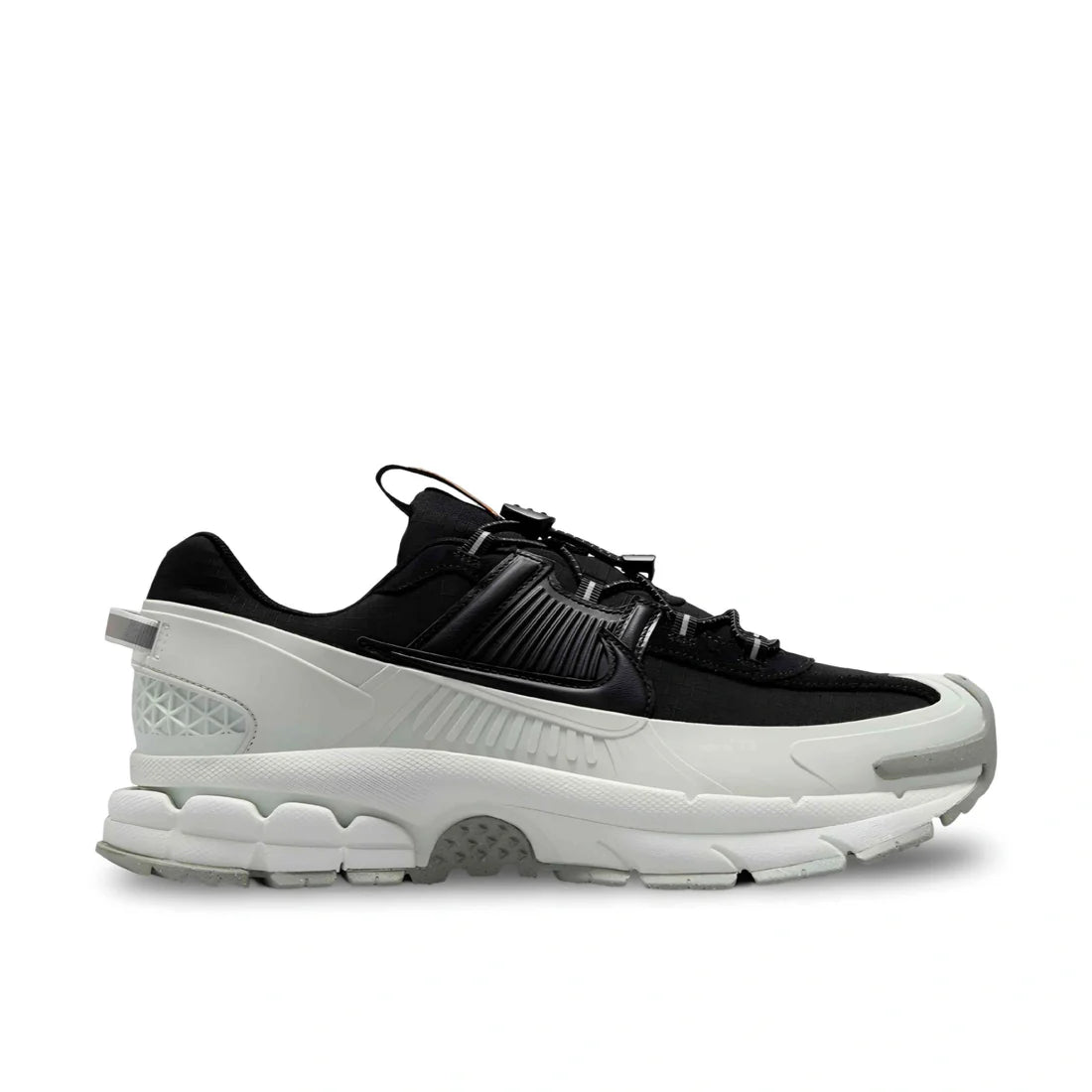 Side view of Nike Vomero Roam Winterized in Black/Silver, showing ripstop upper, rubber cage, and rugged outsole.
