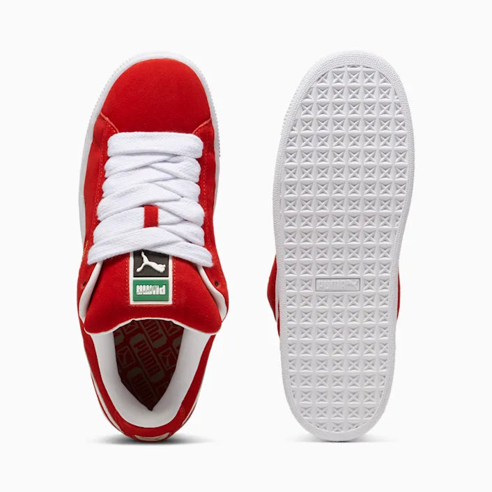 Red sneaker with white laces and sole on a white background