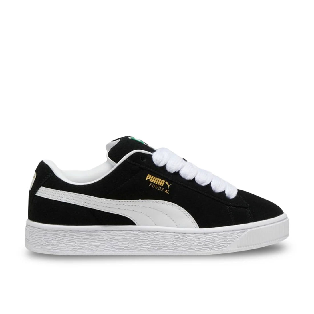 Side view of Puma Suede XL in black and white, showing suede upper, leather Formstrip, and padded collar.