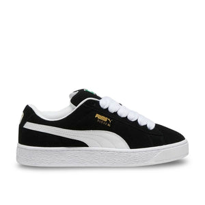Side view of Puma Suede XL in black and white, showing suede upper, leather Formstrip, and padded collar.