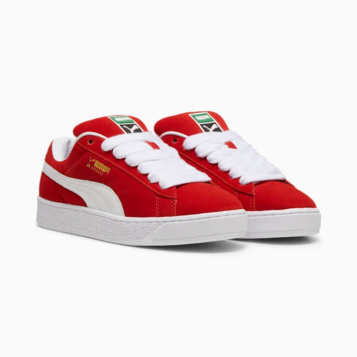 Red and white sneakers with a visible brand logo on a white background